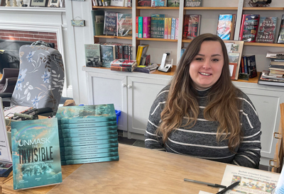 Sierra Longmoore at a book signing for “Unmask the Invisible / An Incredible Story of Faith, Family,and Miracles.”