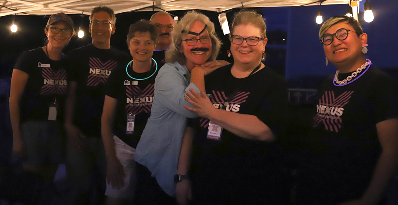 Opera House staff, board members, and volunteers pose under a tent Saturday night. L-R: Kristen Coats, PaulCoats, Chris Morin, Bob Winters, Patrice O’Brien, Barbara Sterling, and Lucas Mendelsohn.