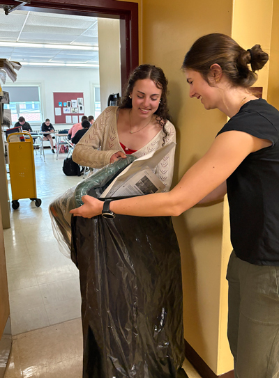 Georgia Gaffney and Mallory Eshbaugh, collecting recycling at LebanonHigh School as part of an SSF initiative.