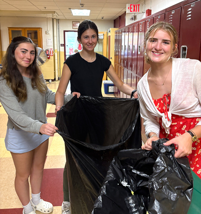 Mariana Utell, Mallory Eshbaugh, and Peyton Rutherford collectingrecycling at Lebanon High School.
