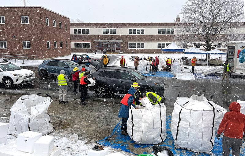 Sustainable Lebanon volunteers collect styrofoam during an April snowstorm